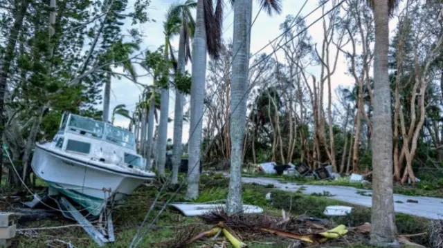 Boat in trees after Hurricane Milton Bradenton Florida