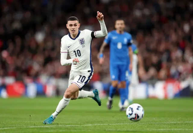 Phil Foden running with the ball