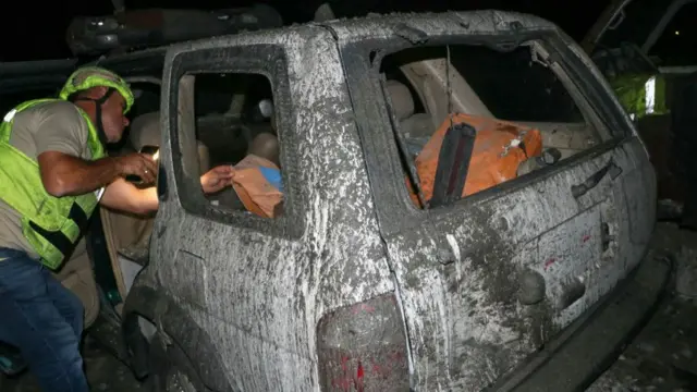 Debris covers wrecked Civil Defence vehicles following an overnight Israeli airstrike in the southern Lebanese village of Derdghaiya,