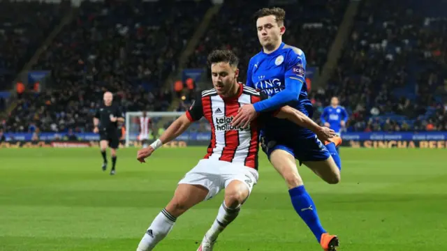 George Baldock and Ben Chilwell chasing a ball during an FA Cup game