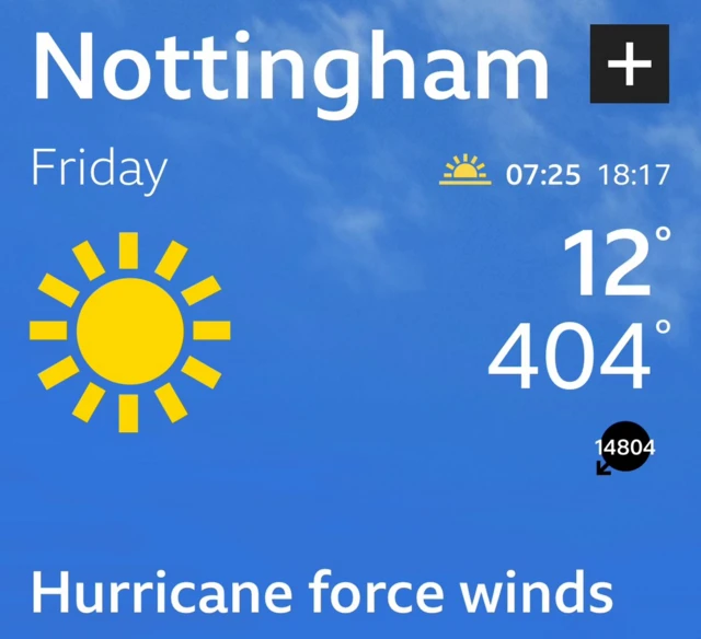 Screengrab of BBC Weather app. There is white writing on a blue background, with a picture of the sun in the top left. It is reporting a temp of 404 and and hurricane force winds