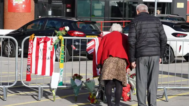 Sheffield United fans laying tributes outside the Bramall Lane stadium in memory of George Baldock