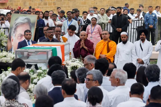 People pay their respects as they attend the final viewing of the former chairman of Tata Group Ratan Tata, in Mumbai,