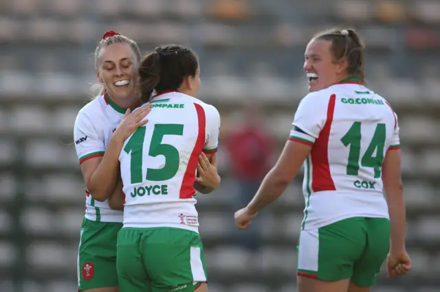 Wales players celebrate Jaz Joyce's try