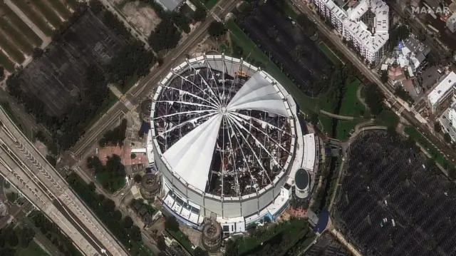 The roof of Tropicana Field stadium has been almost entirely ripped off as seen in a satellite image