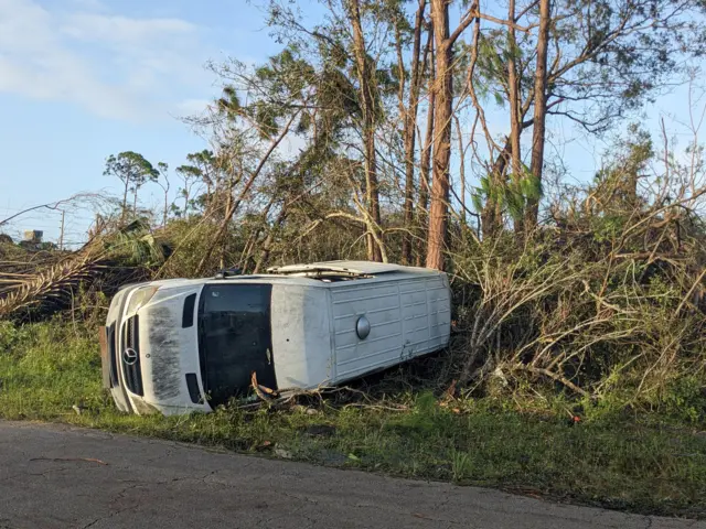 A van flipped on its side