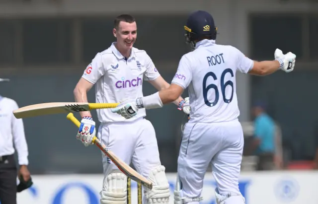 Harry Brook and Joe Root celebrate while batting