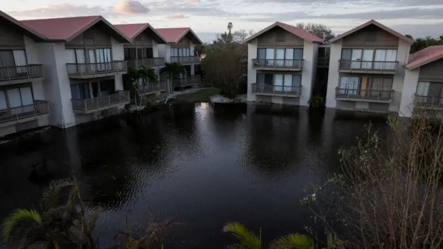 Several houses surrounded by floodwaters in Siesta Key, Florida.