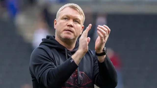 Doncaster manager Grant McCann applauds the club's supporters