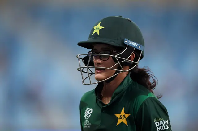 Muneeba Ali of Pakistan walks off