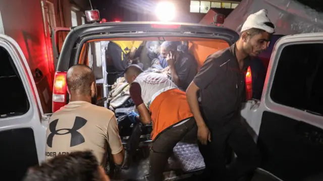 An ambulance bringing injured people to the al-Ahli Baptist Hospital in northern Gaza on 11 Oct