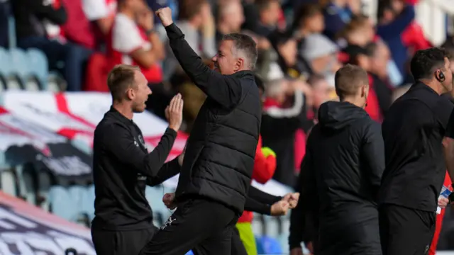 Darren Ferguson celebrates Peterborough's opener against Rotherham