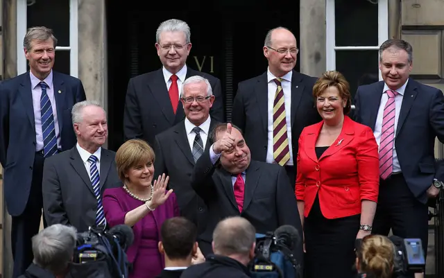 lex Salmond, Scottish National Party (SNP) leader and Scotland's First Minister stands on the steps of Bute House with his new cabinet (L-R) Kenny MacAskill, Michael Russell, John Swinney, Richard Lockhead, Alex Neil, Bruce Crawford, Fiona Hyslop and Nicola Sturgoen on May 19, 2011 in Edinburgh, Scotland. T