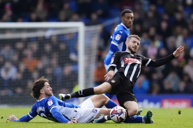 Notts County's Dan Crowley is tackled by Chesterfield's Darren Oldaker