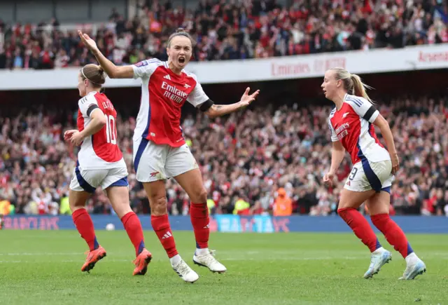 Foord tries to hype the crowd after her goal