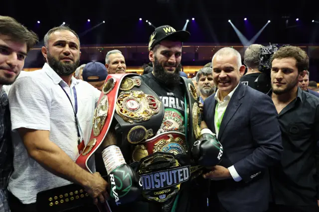 Artur Beterbiev with the light-heavyweight belts