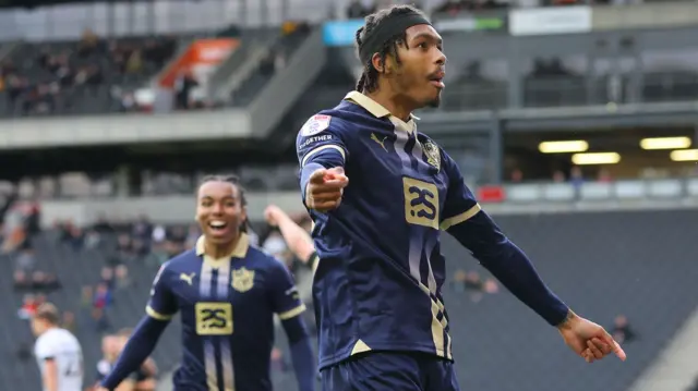 Antwoine Hackford celebrates his goal at MK Dons