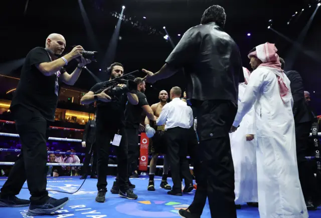 Conor Benn approaches Chris Eubank Jr in the ring