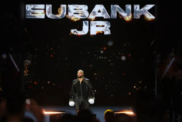 Chris Eubank Jr enters dressed in black