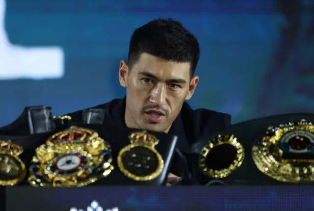 Dmitry Bivol sits behind his world title