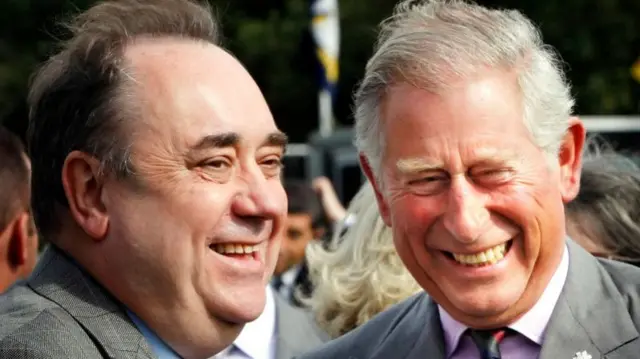 Prince Charles, Prince of Wales laughs with Alex Salmond during a charity race day at Perth Racecourse on August 20, 2011