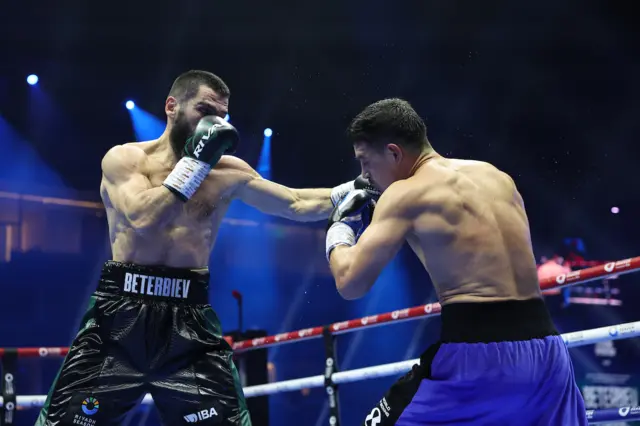 Artur Beterbiev landing a left hook on Dmitry Bivol