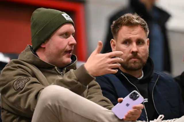 New Crawley Town manager Rob Elliot sits alongside chairman Preston Johnson