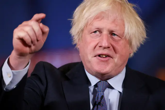 Boris Johnson gesticulates with his finger