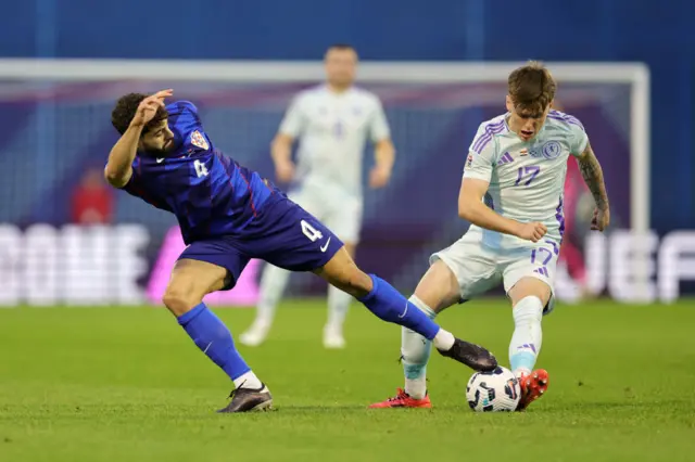 Scotland is challenged by Josko Gvardiol of Croatia during the UEFA Nations League 2024/25 League A Group A1 match between Croatia and Scotland at Stadion Maksimir on October 12, 2024 in Zagreb, Croatia.