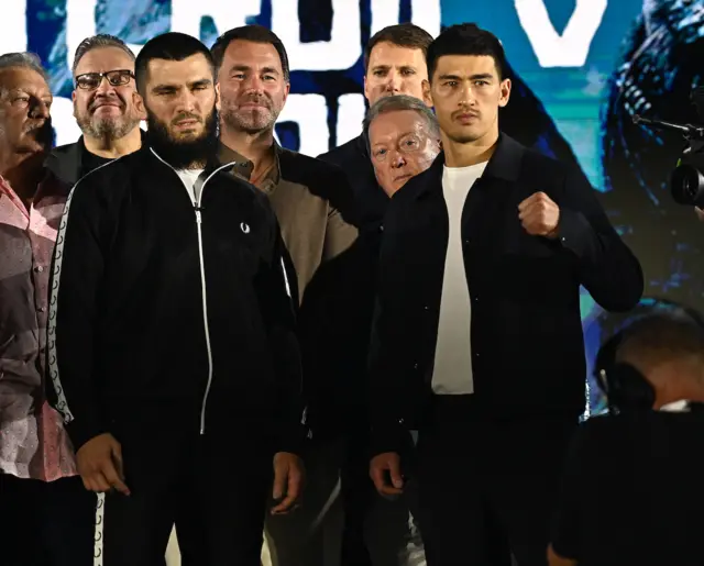 Artur Beterbiev and Dmitry Bivol stand side-by-side