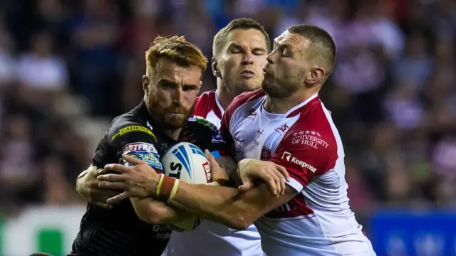 Wigan's Adam Keighran is tackled by Hull KR's James Batchelor during last month's league match