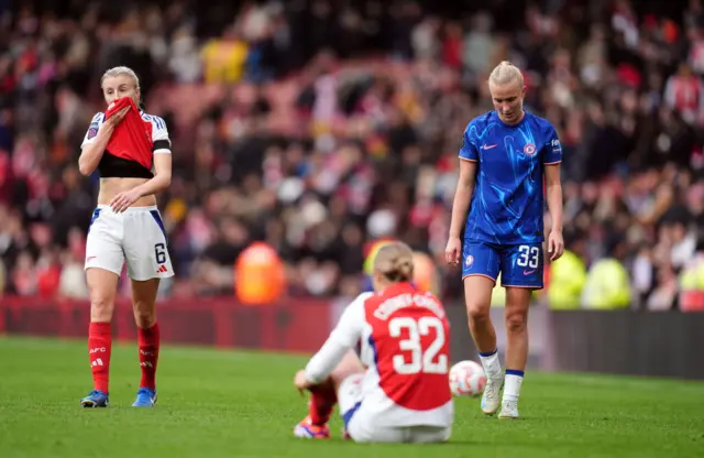 Players react at full time as Chelsea's win is confirmed