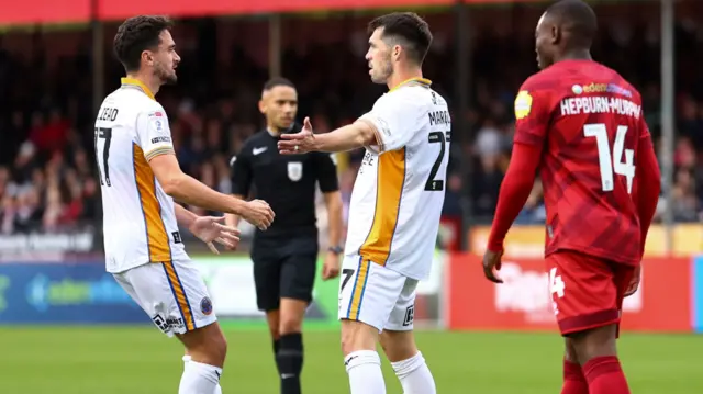 John Marquis celebrates his goal for Shrewsbury at Crawley