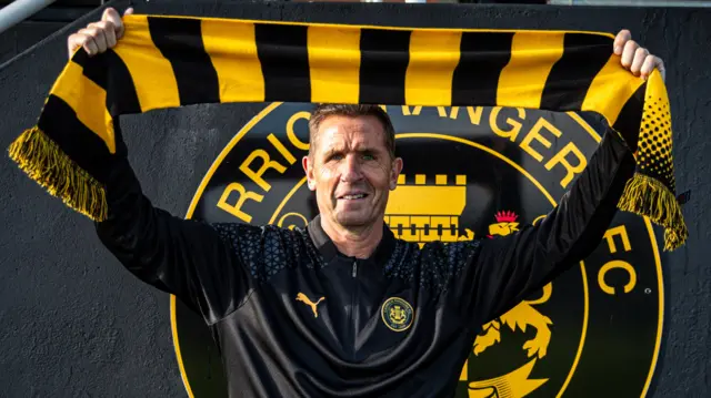 Stephen Baxter shows his new colours after his appointment as Carrick Rangers boss