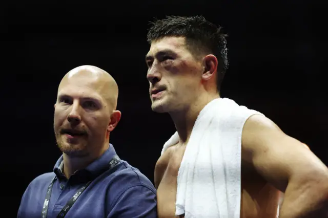 Dmitry Bivol looks on bruised and disappointed