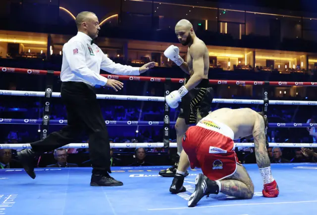 Chris Eubank Jr stands over opponent