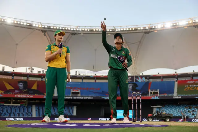 Nigar Sultana of Bangladesh tosses the coin at the coin toss as Laura Wolvaardt