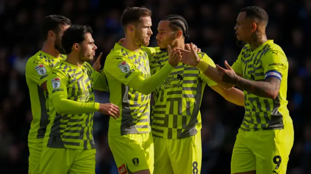 Peterborough players celebrate Sam Nombe's goal at Peterborough