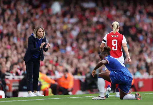 Bompastor applauds her side from the touchline