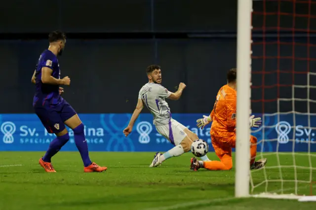 Scotland is challenged by Josko Gvardiol of Croatia during the UEFA Nations League 2024/25 League A Group A1 match between Croatia and Scotland at Stadion Maksimir on October 12, 2024 in Zagreb, Croatia.