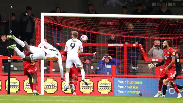 Toto Nsiala hits the target with an acrobatic finish