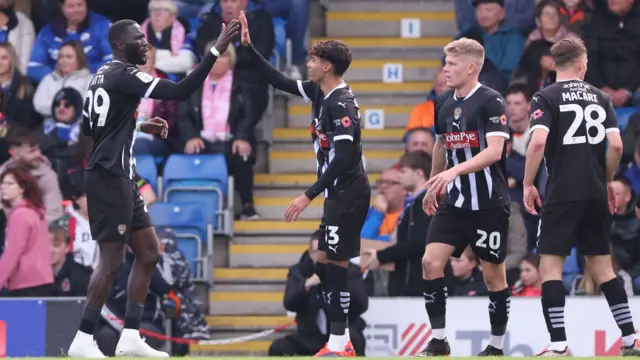 Notts County's Alassana Jatta celebrates his goal against Chesterfield with his teammates