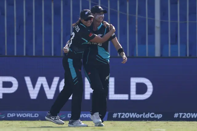 Sophie Devine of New Zealand celebrates with team mate Suzie Bates