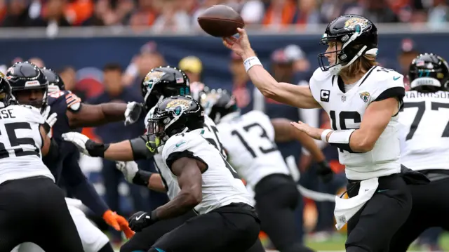 Trevor Lawrence throws a pass