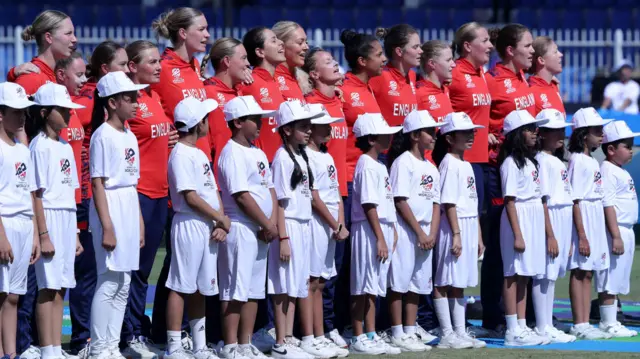 England players line up during the national anthems