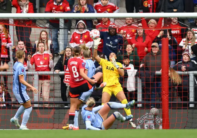 Manchester United's Grace Clinton has her shot saved by Tottenham Hotspur's Rebecca Spencer