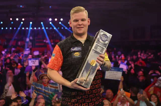 Mike de Decker with the 2024 World Grand Prix trophy