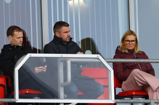 Sarina Wiegman in the stands alongside Dan Ashworth