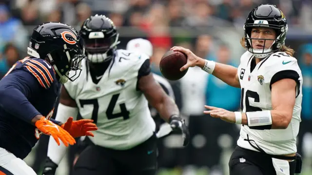 Trevor Lawrence prepares to throw a pass