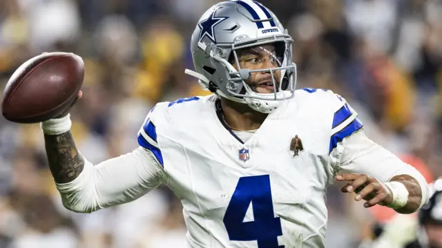 Dallas Cowboys quarterback Dak Prescott throws a pass